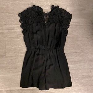 Black. Zip up romper